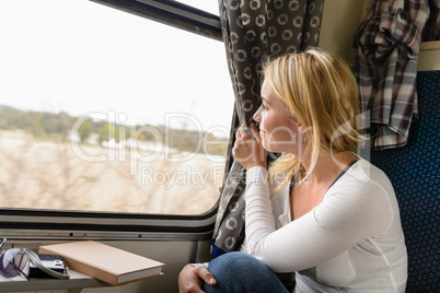 Woman train traveling looking out the window