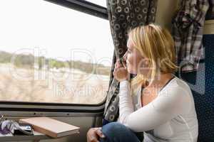 Woman train traveling looking out the window