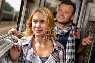 Couple in train looking out the window