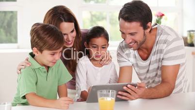 Family using a tablet pc together