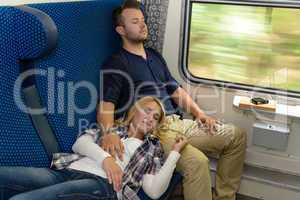 Couple sleeping in train woman man vacation