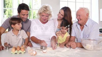 Big family making pastry