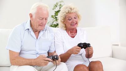 Old couple playing video games