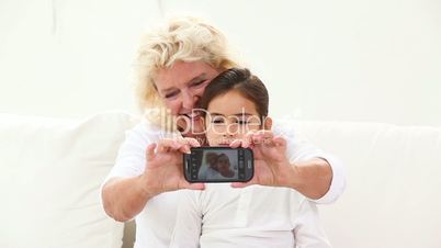 Granny taking picture with phone