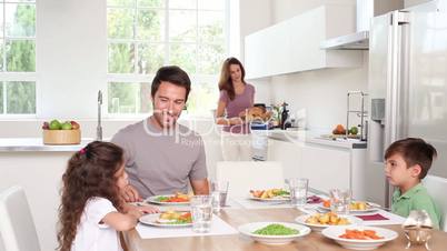 Mother taking chicken dish to her family