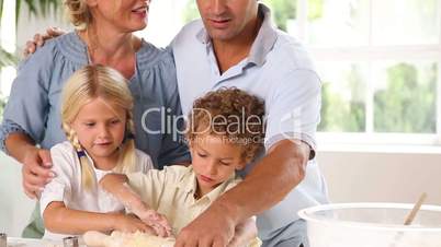 Mother and father baking with their children