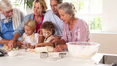 Extended family having fun while baking