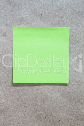 Brown gradient paper background with green note paper