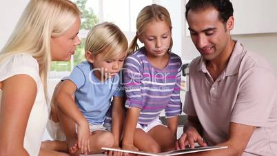 Calm family reading a story together