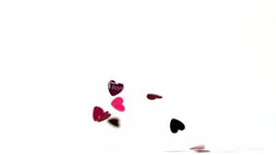 Pink heart confettis falling down