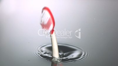 Pink toothbrush falling in water