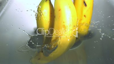 Bananas falling in water
