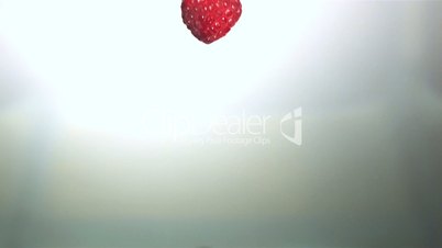 Raspberry falling into water