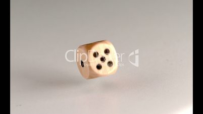 Wood dice revolving and bouncing