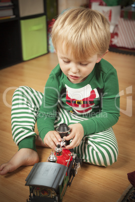 Young Boy Enjoying Christmas Morning Near The Tree