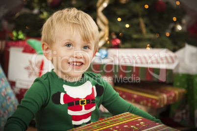 Young Boy Enjoying Christmas Morning Near The Tree