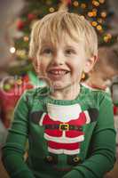 Young Boy Enjoying Christmas Morning Near The Tree