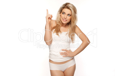 Beautiful blonde woman pointing upwards