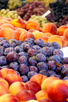 Heap Of Fresh Organic Peaches And Damson Plums