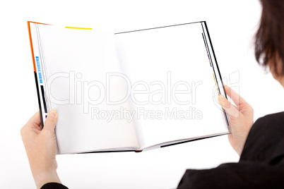 Woman holding open book with blank page