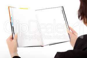 Woman holding open book with blank page