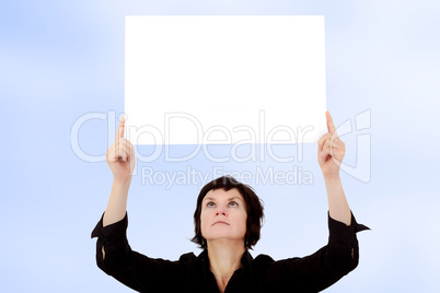 Woman holding up blank poster