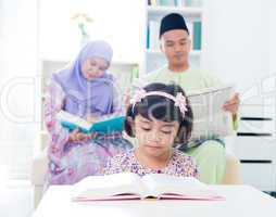 Muslim family reading.