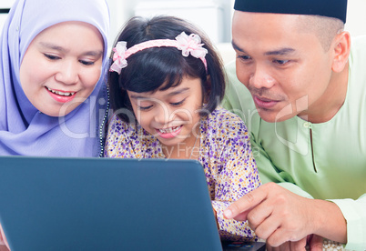 Asian family browsing internet