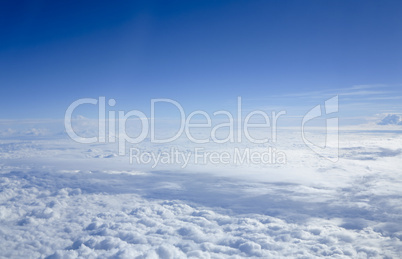 Cloudscape through flight window