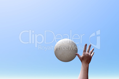 Hand reaching for volleyball