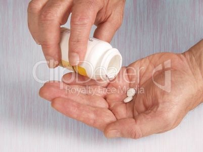 Hands with aspirin