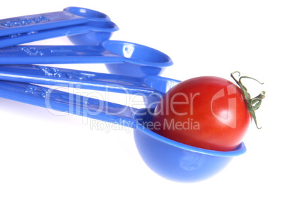 Tomato in measuring spoon