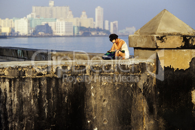 Studying on the Malecon, Havana.