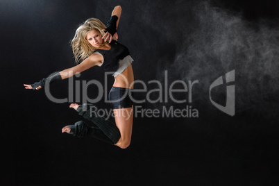 Dancer jumping while performing her dance routine