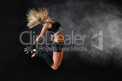Beautiful dancer exercise jump in studio practice