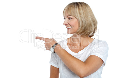 Woman in casuals pointing sideways