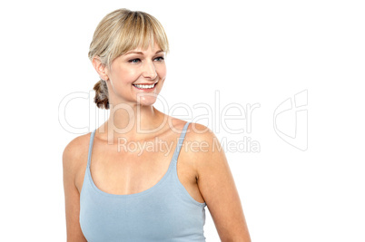 Sexy smiling blonde looking sideways