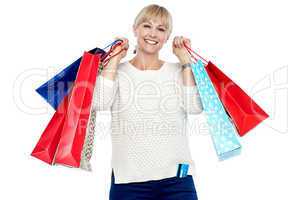 Portrait of a middle aged shopaholic woman