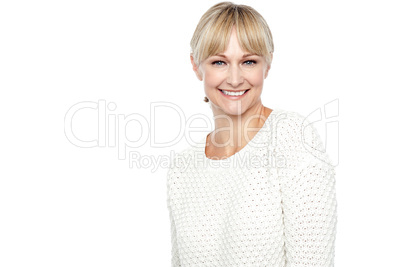 Smiling middle aged woman in trendy wear