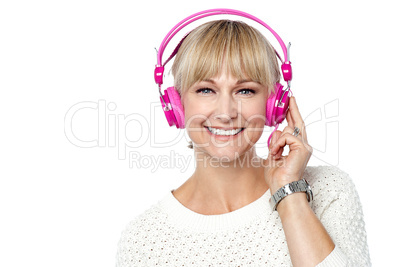 Portrait of a cheerful woman with headphones on