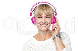 Portrait of a cheerful woman with headphones on
