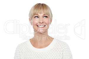 Snap shot of a smiling blonde looking upwards