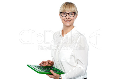 Secretary using large green calculator