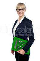 Confident corporate woman holding calculator