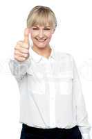 Successful businesswoman showing thumbs up