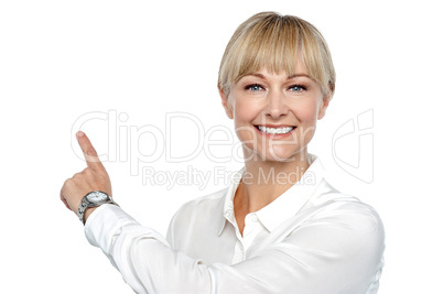Corporate lady pointing backwards