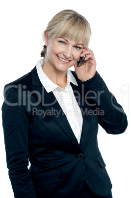 Middle aged corporate woman talking on mobile