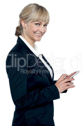 Female executive operating touch screen cellphone
