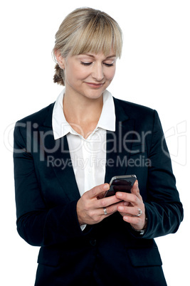 Entrepreneur reading message on her mobile