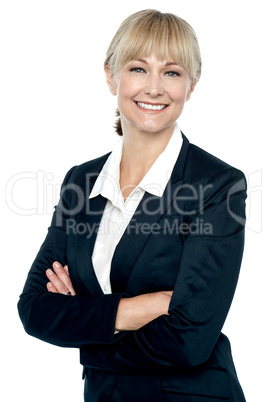 Smiling corporate head posing with folded arms
